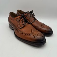 Introducing The Brand New Johnston & Murphy Decatur 20-1356 Leather Wingtip Cognac Sz 9 M. This Stylish Dress Shoe Features A Solid Pattern With An Almond Toe Shape And Lace-Up Closure. The Shoe Is Made With Genuine Leather And Has A Fabric Lining, With A Comfortable Leather Insole. The Shoe Is Perfect For Men Who Want To Make A Fashion Statement. The Outsole Is Made Of Rubber For Additional Durability. The Shoe Is Great For Any Formal Event And Can Be Paired With Any Outfit. Get This Stylish Sh Brown Snip Toe Dress Shoes For Semi-formal Occasions, Timeless Brown Oxfords With Leather Lining, Fitted Wingtip Leather Shoes For Fall, Classic Brown Dress Shoes With Goodyear Welt, Timeless Brown Wingtip Derby Shoes, Timeless Brown Oxfords For Business Casual, Timeless Brown Leather Shoes For Derby, Classic Brown Brogue Dress Shoes, Goodyear Welted Leather Shoes For Semi-formal Fall Events