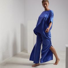 We’ve combined two of our favorites for the perfect, polished lounge ‘fit. The full-coverage, oversized top features a pocket and a high-low hem, while the pant has side slits for ease of movement and ventilation. Adulting has never felt (or looked) this good. Silk Tee, Pant Suits, Oversized Top, Short Leggings, Pant Set, High Low Hem, Tan Color, Cotton Silk, Sweater Top