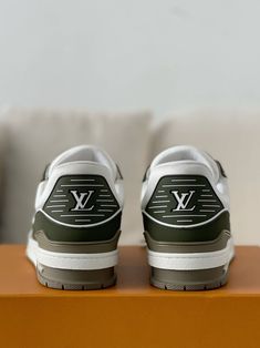 Embrace a touch of nature's elegance with these LV Trainer-inspired sneakers. The refreshing white and green colorway, accented by the iconic Louis Vuitton monogram, creates a sophisticated and sporty look. Crafted with premium materials and meticulous attention to detail, these sneakers offer style and comfort. Perfect for adding a touch of luxury to your everyday wardrobe. Loafer Sneakers, Bottega Veneta Shoulder Bag, Sporty Look, Everyday Wardrobe, Caribbean Netherlands, White Sneaker, Loafer Shoes, Louis Vuitton Monogram, Sneaker Boots