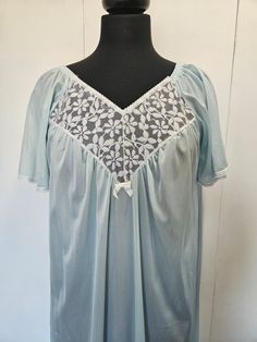 Romantic Vintage 1960s Sheer Blue Nightgown with White Lace Panel. Indulge in timeless elegance with this Vintage Sheer Blue Nightgown with White Lace Detail. The delicate sheer fabric drapes gracefully, while the intricate white lace adds a touch of romance. Perfect for lounging in luxury or surprising a loved one. Add a touch of vintage charm to your nighttime routine with this stunning piece.  The label is from Christele Canada, but there is unfortunately no size tag.  The nightgown is in gre Vintage Sheer Sleepwear For Night, Blue Sheer Vintage Sleepwear, Vintage Blue Sheer Sleepwear, Light Blue Lace Trim Nightgown, Vintage Light Blue Sleepwear With Lace Trim, Light Blue Lace Trim Nightgown For Home, Blue Vintage Wedding Nightgown, Vintage Blue Wedding Nightgown, Vintage Blue Sleepwear