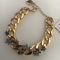 7-5" Heavy Gold Chain With 7 Various-Sized Black Stars Studded With Rhinestones Mounted On Chain. 3/4" In Width. Lobster Claw Closure, 1-1/2" Extender, And Betsey Heart. Gold Findings. Retail - $68. Nwt Party Bracelets With Star Charm In Metal, Party Metal Bracelets With Star Charm, Party Bracelets With Star Charm, Trendy Star Embellished Jewelry For Parties, Trendy Star-embellished Party Jewelry, Trendy Star Embellished Party Jewelry, Cat Charm Bracelet, Rhinestone Rose, Black Stars