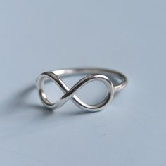 Infinity Ring Modern Twist Infinity Stackable Rings, Adjustable Infinity Stackable Rings With A Modern Twist, Minimalist Infinity Stackable Rings, Modern Infinity Rings For Everyday, Modern Everyday Infinity Rings, Modern Everyday Infinity Ring, Minimalist Infinity Stackable Rings For Everyday, Modern Twist Infinity Stackable Rings As Gift, Classic Adjustable Infinity Stackable Rings