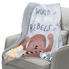 a star wars themed throw blanket on a chair with the words,'the world needs more rebels '