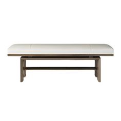 a white bench sitting on top of a wooden table