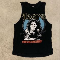 Great The Doors Concert Tee Size: Small Like Brand New Graphic Print Tank Top For Concerts In Spring, Graphic Print Tank Top For Spring Concerts, Crew Neck Tank Top For Spring Concert, Edgy Black Top For Music Festival, Graphic Print Crew Neck Tank Top For Concert, Crew Neck Graphic Print Tank Top For Concert, Black Grunge Top For Concert, Summer Graphic Tee With Band Logo, Black Sleeveless T-shirt For Concert