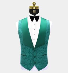 This men's three-piece green damask tuxedo is sure to get you noticed at your next formal affair. This fancy outfit is finely handcrafted from a high-quality material with a delicately textured damask design. This elegant tuxedo set comes with a patterned blazer, a matching vest, and dress pants. The contrasting peak collar, buttons, and pocket piping all provide added class and interest to this set. The lightweight fabric is soft and comfortable as well as stain-resistant. The vest/waistcoat ha Patterned Blazer, Green Tuxedo, Fancy Outfit, Damask Design, Vest Waistcoat, Tuxedo Jacket, Fancy Outfits, Three Piece, Teal Green