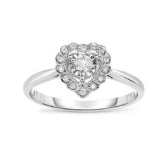 Proclaim your commitment with this heartfelt diamond promise ring. Fashioned in cool 10K white gold, this romantic design features a shimmering 1/10 ct. diamond center stone artfully set to enhance size and sparkle. Additional diamonds and intricate milgrain detailing line the ring's heart-shaped frame. Radiant with 1/6 ct. t.w. of diamonds and a bright polished shine, this promise ring is a brilliant celebration of your love. Size: 7.  Gender: female.  Age Group: adult. Diamond Solitaire Heart Ring In White Gold, White Gold Diamond Solitaire Heart Ring, White Gold Heart Cut Diamond Promise Ring, White Gold Heart Cut Promise Diamond Ring, White Diamond Heart Ring With Halo Setting, Heart Cut White Gold Diamond Promise Ring, Heart Cut White Gold Promise Ring, Diamond Heart Ring With Halo Setting For Promise, White Gold Cluster Ring With Diamond Accents For Promise