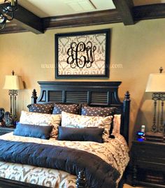 a bed with blue and white comforter in a bedroom next to two nightstands