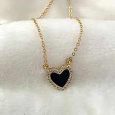 Elegant heart necklace. Upgrade your jewelry collection with this stunning Black Heart Necklace.  This dainty heart necklace is a lovely gift for your loved one, perfect as an anniversary gift. Order yours today and enjoy its timeless beauty! ♥ ITEM DESCRIPTION: The total length of the gold necklace: is 14, 16, 18, 20  inches. The length of the necklace refers to the total length from end to end. Pendant height: 1.7 cm Pendant width: 1.6 cm Materials: 18k Gold plated - Enamel with zirconia heart Black Heart Pendant Necklace With Clavicle Chain, Minimalist Black Heart Charm Necklace, Minimalist Black Heart Necklace, Elegant Black Open Heart Necklace, Black Dainty Clavicle Charm Necklaces, Black Heart Necklace With Adjustable Chain, Black Clavicle Chain Necklace For Valentine's Day, Dainty Black Clavicle Chain Charm Necklace, Black Heart Necklace With Adjustable Chain For Valentine's Day