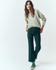 The Kevin Pant. is a tribute to Meritt’s late husband's personal style. Inspired by 70’s men's vintage trousers, this structured twill pant has a mid-rise with a square top block for a snug fit through the waist, hips, and legs before falling into a charming kick at the hem, finished with classic five-pocket denim details like a zip fly, and a pressed crease down the leg. Style them back to their matching The Shrunken Sweatshirt. for the kind of tonal, high/low look we love. 100% Polyester Machi Retro Fall Jeans For Office, Retro Workwear Jeans For Fall, Retro Bottoms With Relaxed Fit And Straight Hem, Retro Straight Leg Pants For Fall, Green Straight Leg Work Pants For Fall, Retro Green Pants For Fall, Retro Trousers Jeans For Fall, Vintage Bottoms With Straight Hem For Fall, Retro Jeans Shaped As Trousers For Fall