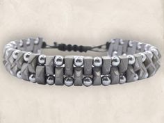 ✨ Elevate your style with our Authentic Hematite Men's Bracelet! This stunning piece features certified genuine hematite, known for its sleek, metallic shine. 🌟 🔹 Handcrafted Excellence: Each bracelet is meticulously crafted with natural hematite stones, making every piece unique. 🔹 Adjustable Comfort: The stylish cord design ensures a perfect fit for all wrist sizes. 🔹 Versatile Style: Perfect for everyday wear or as a statement accessory for special occasions. 🌌 Whether you're dressing up Adjustable Hematite Bracelets, Modern Silver Hematite Bracelets, Hematite Stone, Men's Bracelet, Braided Bracelets, Versatile Style, Mens Bracelet, Natural Stone, Natural Stones