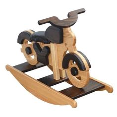 a wooden toy motorcycle with black wheels