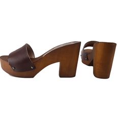 HANDMADE CLOGS wood-effect clogs made in italy -brown leather upper -heel 9 cm + plateau 3 cm -craftsman-made DON'T FORGET TO CHECK THE SIZE BEFORE YOU COMPLETE THE ORDER Size and LENGTH OF THE SHOE ALONG THE CURVE: 36 EU = 5 US = UK 4 = 23.50 CM 37 EU = 6 US = UK 5 = 24.00 CM 38 EU = 7 US = UK5.5 = 24.50 CM 39 EU = 8 US = UK 6 = 25.00 CM 40 EU = 9 US = UK6.5 = 25.50 CM 41 EU = 10US = UK7.5 = 26.00 CM Brown Open Toe Clogs With 4-inch Heel, Brown Wooden Heels With Leather Sole, Brown High Heel Sandals With Wooden Heel, Brown High Heel Clogs With Wooden Heel, Brown Open Toe Wooden Clogs, Brown High Heel Mules With Wooden Heel, Brown Platform Wedge Heel Mules, Brown High Heel Mules With Deep Heel Cup, Brown Closed Toe Platform Clogs