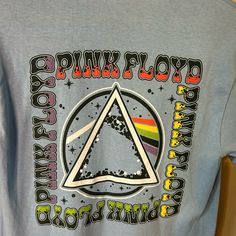 a t - shirt with the pink floyd pyramid on it's front and back