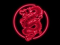 a red neon sign with a dragon on it's face in the middle of a circle