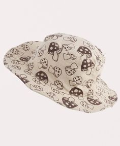 This Many Mushrooms Mushroom Hat will look cute  and stylin' with any hippie attire. Perfect for wearing at the beach, woods, or music festival. Designed with groovy, screen printed mushrooms and finished with a wire brim. Ethically made in Nepal. 100% Cotton. Natural. One size fits most. Inside circumference of this hat may vary slightly, but the base of the band typically measures 25 inches and 20 inches at the crown. Mushroom Stocking Hat, Whimsical Adjustable Summer Hats, Whimsical Adjustable Beach Hat, Cute Adjustable Beige Sun Hat, Cute Beige Hats For Vacation, Cute Beige Hat For Vacation, Whimsical Short Brim Beach Hat, Cute Beige Beach Hats, Whimsical Beach Hat