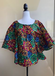 Stylish Handmade Ankara Peplum Tops/Blouses  This Peplum top suits every occasion for whatever you decide to wear it with, whether you add pants or a skirt with it, you will definitely feel like the luckiest and pretty  girl in the world. Bring on that charm!  KINDLY NOTE:  Fabric colors may vary slightly due to light and electronic setting. I have tried my best to reflect natural  and true colors  of the fabric but it may appear slightly different due to the varied representation of colors on e Printed Green Blouse For Party, Green Printed Blouse For Party, Colorful Short Sleeve Cotton Blouse, Multicolor Print Top For Party, Fitted Multicolor Tops With Colorful Pattern, Green Short Sleeve Blouse With Vibrant Print, Festive Green Short Sleeve Top, Fitted Multicolor Print Top For Parties, Multicolor Spring Party Blouse Piece