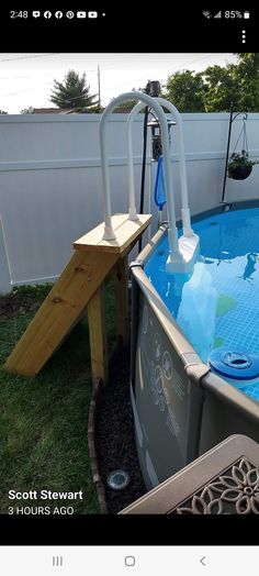 an above ground swimming pool with ladders attached to it