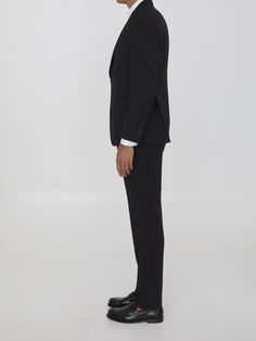 This two-piece suit is made of black virgin wool and includes a single-breasted jacket with peaked lapels, a brooch on the lapel, a front button closure, two front welt pockets, a welt pocket on the chest, and buttoned cuffs. The straight-leg trousers feature a zip, button, and hook-and-eye closure, as well as two side welt pockets and two rear buttoned welt pockets. Size nationality: Italy Buttoned cuffs Peaked lapels Button closure Front pockets Straight leg pants Rear pockets Regular fit Prod Leather Cap, Single Breasted Jacket, Wool Suit, Straight Leg Trousers, Blazers For Men, Emilio Pucci, Designer Suits, Denim Pant, Italian Fashion