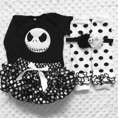 three pieces of clothing with polka dots and a skull on the front, one is black and white