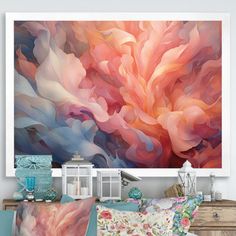 an abstract painting hangs on the wall above a bed with colorful pillows and throw pillows