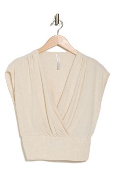 A surplice neckline and smocking at the back adds gorgeous shape to this linen-rich top. 19" length Surplice V-neck Short sleeves 70% rayon, 30% linen Machine wash, line dry Imported Versatile Beige V-neck Top, Chic V-neck Wrap Top For Beach, Chic Linen V-neck Top, Ruched V-neck Top For Vacation, Cropped Linen Tops For Brunch, Chic V-neck Wrap Top For Vacation, Summer Linen Tops With Smocked Back, Chic Linen Top With Smocked Bodice, Versatile Summer V-neck Wrap Top