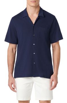 Crafted for comfort in a soft, stretchy knit, this short-sleeve button-up features a notched collar and a handy chest pocket. 30 1/2" length; 44" chest Front button closure Notched collar Short sleeves Chest patch pocket 62% polyester, 33% cotton, 5% spandex Machine wash, dry flat Imported Spring Short Sleeve Polo Shirt, Fitted Casual Polo Shirt With Pockets, Fitted Collared Polo Shirt With Pockets, Fitted Short Sleeve Polo Shirt With Pockets, Fitted Polo Shirt With Pockets For Summer, Fitted Summer Polo Shirt With Pockets, Cotton Tops With Welt Pockets And Collared Neckline, Navy Polo Collar Shirt For Summer, Short Sleeve Polo Shirt With Placket For Work