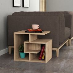 a coffee table with three shelves in front of a couch