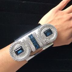 Atelier Swarovski By Karl Lagerfeld Collection Silver Tone And Blue Snake Crystal Cuff Bracelet. This Big Cuff Bracelet Instantly Classes Up Any Outfit. It'll Be Sure To Catch Eyes And Bring In The Compliments. Snake Like Design With Small White Crystals And Bigger Blue Pieces. Small Scratches On The Silver Cuff. Ships In A Swarovski Box And/Or In A Pouch. Luxury Rhinestone Bracelets For Party, Luxury Rhinestone Party Bracelets, Silver Rhinestone Cuff Bracelet For Party, Formal Crystal Cuff Bracelet With Rhinestones, Luxury Evening Bracelets With Bling, Luxury Silver Cuff Bracelet With Diamond Accents, Luxury Blue Cuff Bracelet, Glamorous Silver Cuff Bracelet With Rhinestones, Luxury Silver Cuff Bracelet For Formal Events