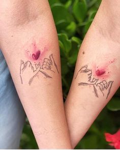 two people with matching tattoos on their arms