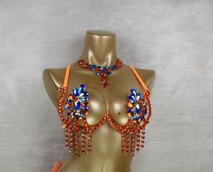 a mannequin wearing an orange bra with beads