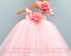 Transform your little one into a fairytale vision with our whimsical pink tulle butterfly dress! This enchanting dress is adorned with a beautiful blend of soft pink flowers in varying shades, from blush to rosy hues, and delicate butterflies scattered across the tulle skirt. Perfect for flower girls, birthday parties, or any special occasion where a touch of magic is desired. Made with love, this dress ensures your toddler feels like a true princess. Watch as she flutters around in this dreamy Tulle Butterfly, Tutu Dress Pink, Toddler Birthday Dress, Enchanting Dress, Tulle Tutu Dress, Pink Tutu Dress, Butterfly Fairy, Tulle Tutu, Toddler Birthday