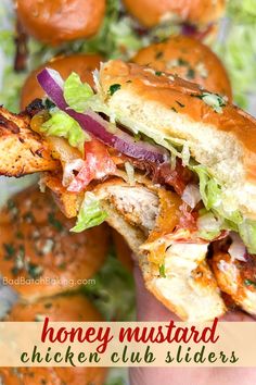 a chicken club sandwich with lettuce, tomato and onions in the background text reads honey mustard chicken club sliders