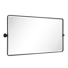 a bathroom mirror with a black frame and metal fittings on the bottom half of it