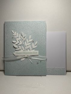 a card that has been made with the wedding day stamp on it and is sitting next to another card