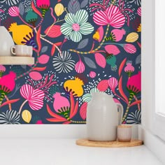 the wallpaper in this room is colorful and has flowers on it, as well as plants