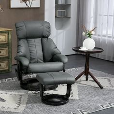 Experience the bliss of a HOMCOM massage recliner chair with ottoman. Enjoy a soothing massage from ten massage points on the back, lumbar, seat cushion, and ottoman. The reclining backrest lets you find your most comfortable position while the ottoman provides complete leg support. The side pouch keeps your essentials conveniently within reach. Encourage relaxation and enhance your well-being with HOMCOM's massage chair and ottoman. Size: 30" W x 31.5" D x 40.25" H.  Color: Gray. Swivel Chair With Ottoman, Entertainment Rooms, Massage Office Chair, Recliner With Ottoman, Chair With Ottoman, Blue Armchair, Leather Recliner Chair, Fabric Gray, Swivel Recliner