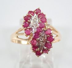 Yellow Gold Estate Vintage Ruby and Diamond Cocktail Ring. This ring is set with four Round Diamonds and seventeen genuine Round Rubies. The Rubies in this ring are a medium red color and weigh a total of .75 carat. The diamonds in this ring are H color, I1 clarity and weigh a total of .04 carat. This ring is 10K Yellow Gold, weighs 2.5 grams and is a finger size 7, can be resized (please inquire about sizing with the finger size you need). This ring dates back to Circa 1980's and will also be a Infinity Symbol Design, Symbol Design, Gold Diamond Jewelry, Diamond Cocktail Rings, Infinity Symbol, Jewelry Unique, Vintage Engagement, Multi Stone Ring, Natural Ruby