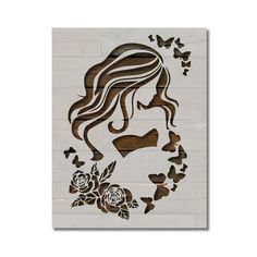 a cutout of a woman with flowers and butterflies in her hair, on a white background