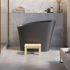 a bath tub sitting in the middle of a bathroom next to a footstool