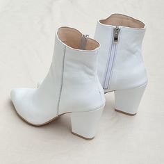 "Lira - handmade high heel boots made of high-quality white genuine leather. The exceptionally soft upper and comfortable leather insole guarantee the highest comfort. The shoes have a fitted upper and a carefully profiled toe, the slim shape visually lengthens the figure. High heel 8 cm = 3\" Sizes UK, EU, US/ feet dimensions / centimeters and inches 3 UK / 36 EU / 5 US insoles length 24 cm = 9.5 inches 4 UK / 37 EU/ 6 US insoles length 25 cm = 9.8 inches 5 UK / 38 EU / 7 U insoles length 25.5 White Leather Heeled Boots For Fall, White High Ankle Boots For Fall, White High Ankle Heels For Fall, Elegant White Booties For Spring, Elegant White Spring Booties, White High Ankle Boots With Sculpted Heel, White Block Heel Booties For Fall, Chic White Ankle-high Booties, White Ankle-high Heels For Fall