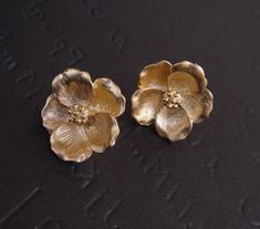 Mother Earrings, GOLD Magnolia Earrings, Stud Flower Earrings, Bridesmaid Gift Ideas, Mother Day from Daughter, Bridesmaid Earrings Beautiful set earrings of golden magnolia flower made of matte gold plated. These earrings come with .925 sterling silver post. Measurement Dimensions - 19.5mm These earrings are available in SILVER. Please leave a note at Check out if you want to purchase SILVER instead Matching Necklace https://www.etsy.com/listing/175334618/gold-magnolia-necklace-flower-pendant S Magnolia Earrings, Flower Magnolia, Bridesmaid Gift Ideas, Earrings Bridesmaid, Magnolia Flower, Earrings Stud, Matching Necklaces, Bridesmaid Earrings, Flower Pendant