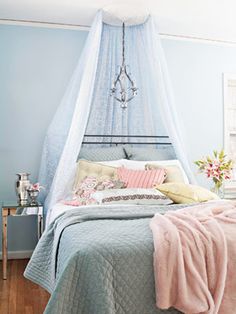 a bed with a blue canopy over it