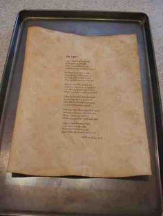 a piece of parchment paper with writing on it in a metal frame sitting on the floor