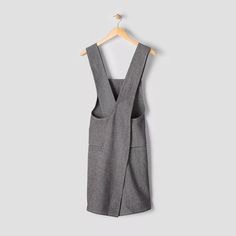 a gray dress hanging on a hanger