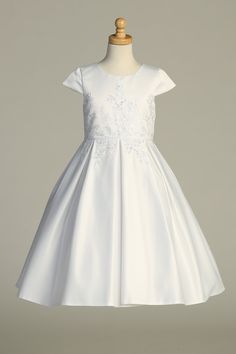 Introducing the Gorgeous White First Communion Dress by Lito – a great blend of elegance and charm that will make your sweet girl shine on her special day. Impeccably tailored, this dress features a flattering A-line silhouette and boasts intricately embroidered tulle adorned with delicate sequins, adding a touch of subtle sparkle that captures the essence of the occasion.Designed with your convenience in mind, the dress features a practical zipper closure, ensuring easy and hassle-free dressing Elegant A-line Confirmation Dress, White A-line Princess Dress For Wedding, Elegant Fitted Ball Gown With Floral Applique, A-line Princess Dress For Wedding, A-line Dress With Floral Applique And Fitted Bodice, Princess Style A-line Wedding Dress, Embroidered Ball Gown Dresses For Formal Occasions, Elegant Ball Gown With Floral Applique And Fitted Bodice, White A-line Princess Wedding Dress