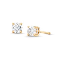 Light up your look with the timeless sparkle of these certified round diamond solitaire stud earrings in 14K gold. Crafted in 14K gold Each earring showcases a 1/4 ct. certified round diamond boasting a color rank of I and clarity of I1. A ribbon of diamonds wraps the center in a hidden halo design. Captivating with 5/8 ct. t.w. of diamonds Includes certification card These post earrings secure comfortably with friction backs. Classic Yellow Gold Diamond Earrings For Formal Occasions, Classic Gold Diamond Earrings With Brilliant Cut, Classic Gold Diamond Earrings, Classic Solitaire Diamond Earrings For Anniversary, Classic Yellow Gold Diamond Earrings, Classic Yellow Gold Clip-on Diamond Earrings, 14k Gold Solitaire Diamond Earrings, 14k Gold Solitaire Diamond Earrings Round Cut, Classic Yellow Gold Diamond Earrings With Prong Setting