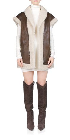 Luxury Faux Fur Vest, Faux Fur Coat Vest, Luxury Sheepskin Women's Vest, Luxury Classic Vest, Luxury Brown Vest With Pockets, Chic Brown Winter Vest, Luxury Sleeveless Outerwear For Fall, Elegant Brown Winter Vest, Sleeveless Sheepskin Vest For Fall