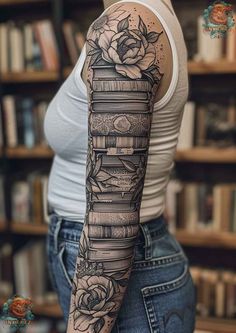 a woman's arm with books and roses tattooed on her sleeve, in front of a book shelf