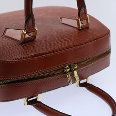 Brand: Louis Vuitton Model: Voltaire Color: Brown Material: Leather Inclusions: / Dimensions: W27cm x H21cm x D12cm Serial number: TH0938 Country of origin: France Condition: AB - good condition. This Louis Vuitton handbag, known as the Voltaire Epi, exudes sophistication in a rich brown hue and is meticulously crafted from exquisite Epi leather. This handbag, bearing the distinctive stamp of French craftsmanship, exemplifies the timeless style associated with Louis Vuitton. Its elegant design, Travel Rectangular Case Bag With Gold-tone Hardware, Rectangular Travel Case With Gold-tone Hardware, Classic Rectangular Satchel For Shopping, Luxury Brown Box Bag For Office, Formal Rectangular Case Bag With Zipper Closure, Modern Brown Briefcase With Gold-tone Hardware, Vintage Office Satchel With Zipper Closure, Luxury Cognac Bag With Zipper Closure, Brown Box Bag With Gold-tone Hardware For Business